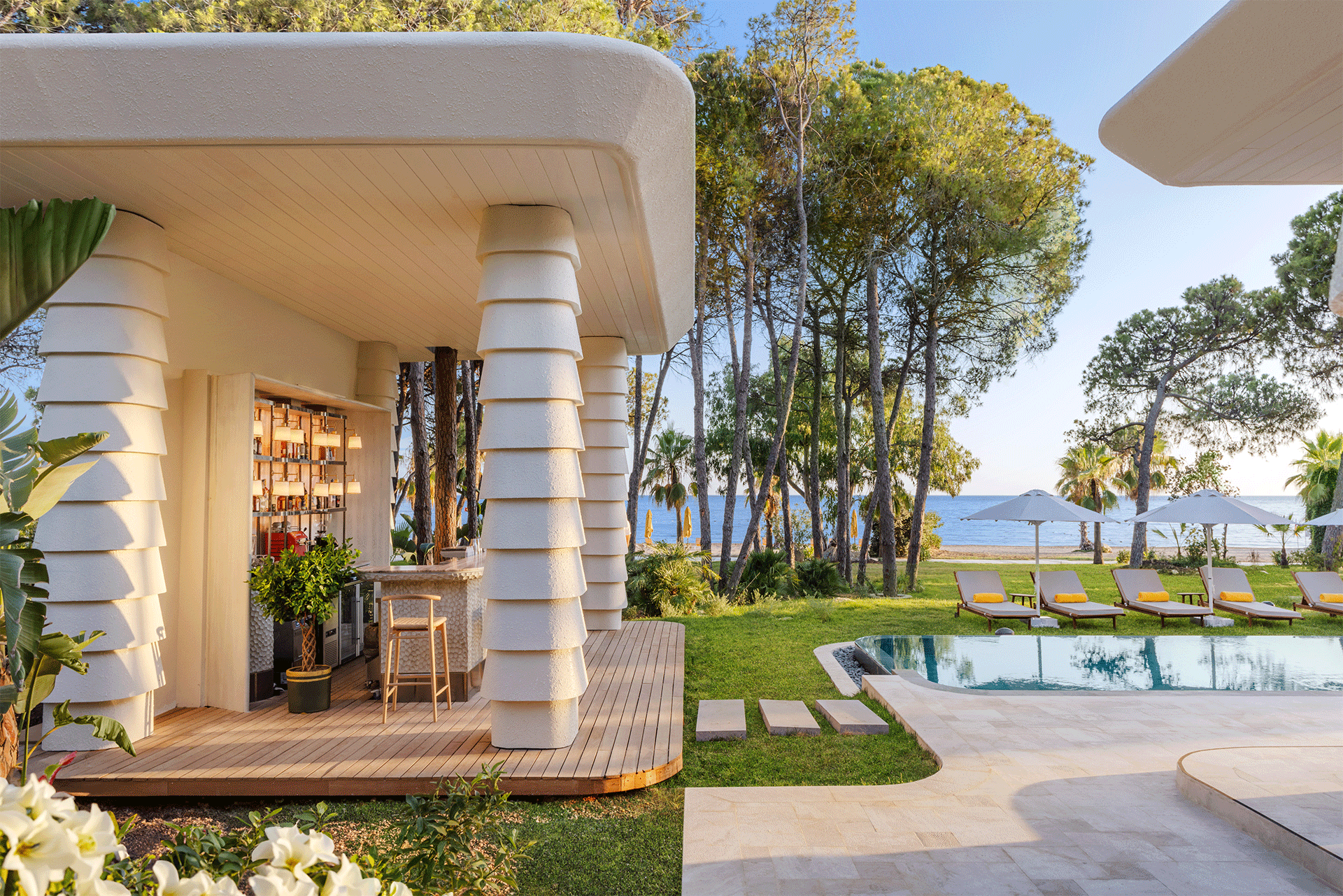 A house with a pool and a bar in front of it