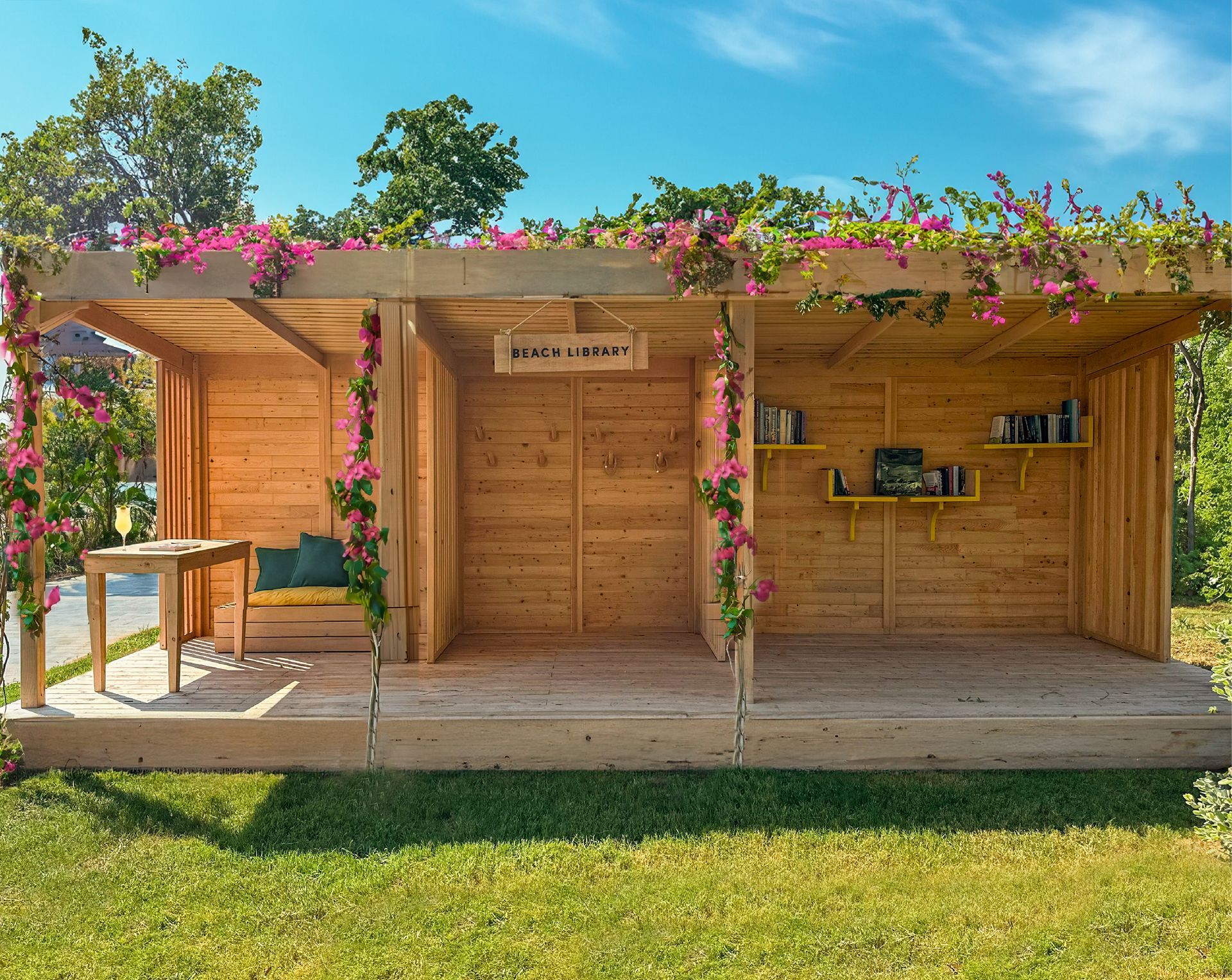 A small wooden house with flowers on the roof